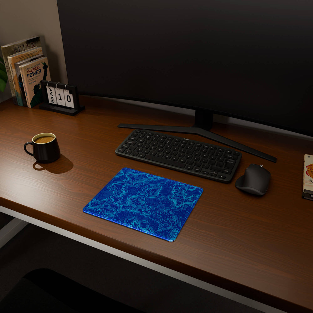 Full desktop view featuring a compact 29x25CM-11.4x9.8in mousepad with 'Blue Topographic' design, inspired by blue minimalist topographic art. This space-saving mousepad offers a comfortable and smooth area for essential mouse movement, ideal for small or minimalist desks.