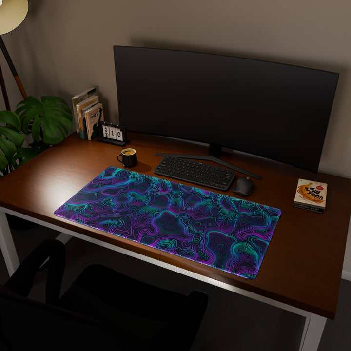 Full desktop view featuring an ultra-wide 100x50CM-39.3x19.6in large mouse pad / desk mat with 'Neon Topographic' design, inspired by vibrant neon topographic art. Offering excellent desk protection and space, this oversized mat is ideal for multi-monitor setups or users requiring vast movement freedom.
