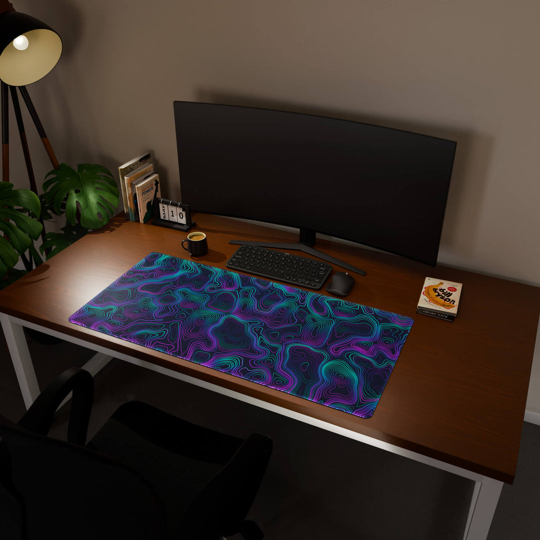 Full desktop view featuring a generously sized 120x57CM-47x22.4in large mouse pad / desk mat with 'Neon Topographic' design, inspired by vibrant neon topographic art. Its ample dimensions cater to both demanding gaming and professional tasks, ensuring consistent performance and a neat workspace.