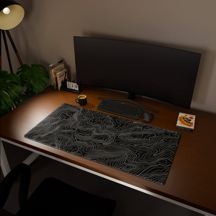 Full desktop view featuring an extra-large 120x60CM-47x23.6in large mouse pad / desk mat with 'Classic Topographic' design, inspired by minimalist topographic line art. This maximum coverage mat transforms your entire desk surface into a unified, high-performance area, perfect for demanding users and full-desk setups.
