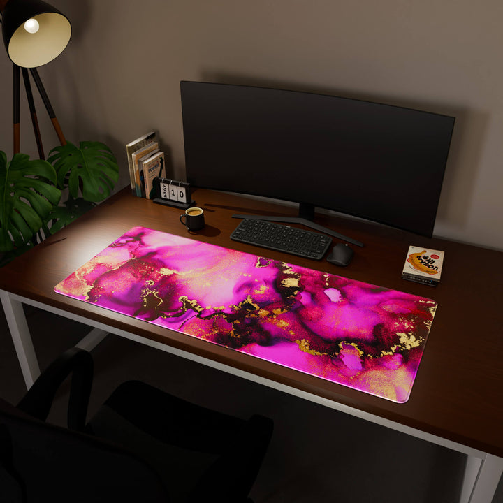 Full desktop view featuring an ultra-wide 140x57CM-55x22.4in large mouse pad / desk mat with 'Pink & Gold' design, inspired by pink and gold alcohol ink art. Its enormous size offers unparalleled desk protection and space, designed for large-scale workstations and immersive gaming.