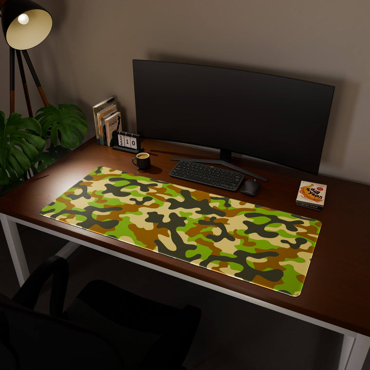 Full desktop view featuring an ultra-wide 140x57CM-55x22.4in large mouse pad / desk mat with 'Woodland Camo' design, inspired by a classic woodland camouflage pattern. Its enormous size offers unparalleled desk protection and space, designed for large-scale workstations and immersive gaming.