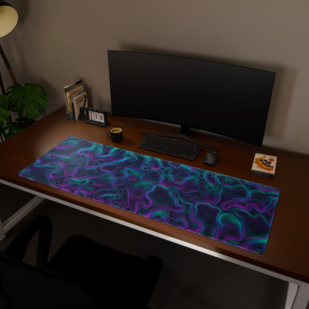 Full desktop view featuring a massive 160x57CM-63x22.4in large mouse pad / desk mat with 'Neon Topographic' design, inspired by vibrant neon topographic art. This premium, full-desk mat provides the ultimate coverage for an entire workstation, protecting the surface and unifying the space.