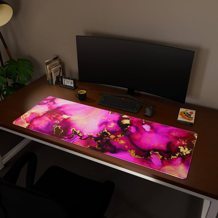 Full desktop view featuring a massive 160x57CM-63x22.4in large mouse pad / desk mat with 'Pink & Gold' design, inspired by pink and gold alcohol ink art. This premium, full-desk mat provides the ultimate coverage for an entire workstation, protecting the surface and unifying the space.