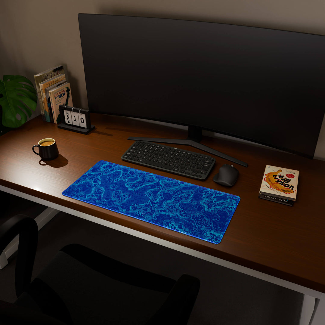 Full desktop view featuring a versatile 70x30CM-27.5x11.8in large mouse pad / desk mat with 'Blue Topographic' design, inspired by blue minimalist topographic art. Its balanced dimensions offer sufficient room for efficient navigation, making it a perfect and stylish upgrade for any standard desk.