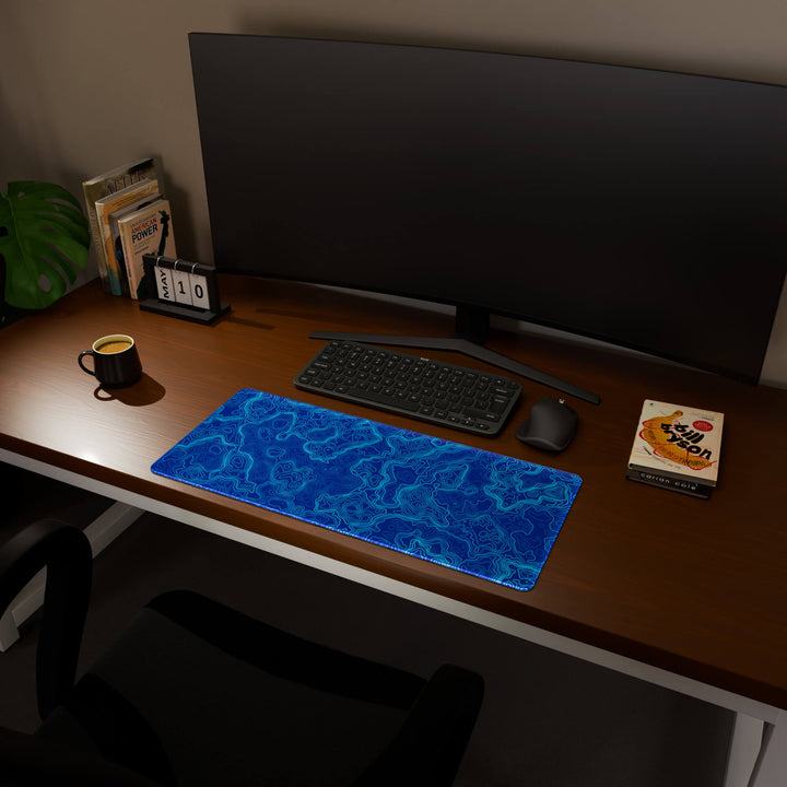Full desktop view featuring a versatile 70x30CM-27.5x11.8in large mouse pad / desk mat with 'Blue Topographic' design, inspired by blue minimalist topographic art. Its balanced dimensions offer sufficient room for efficient navigation, making it a perfect and stylish upgrade for any standard desk.