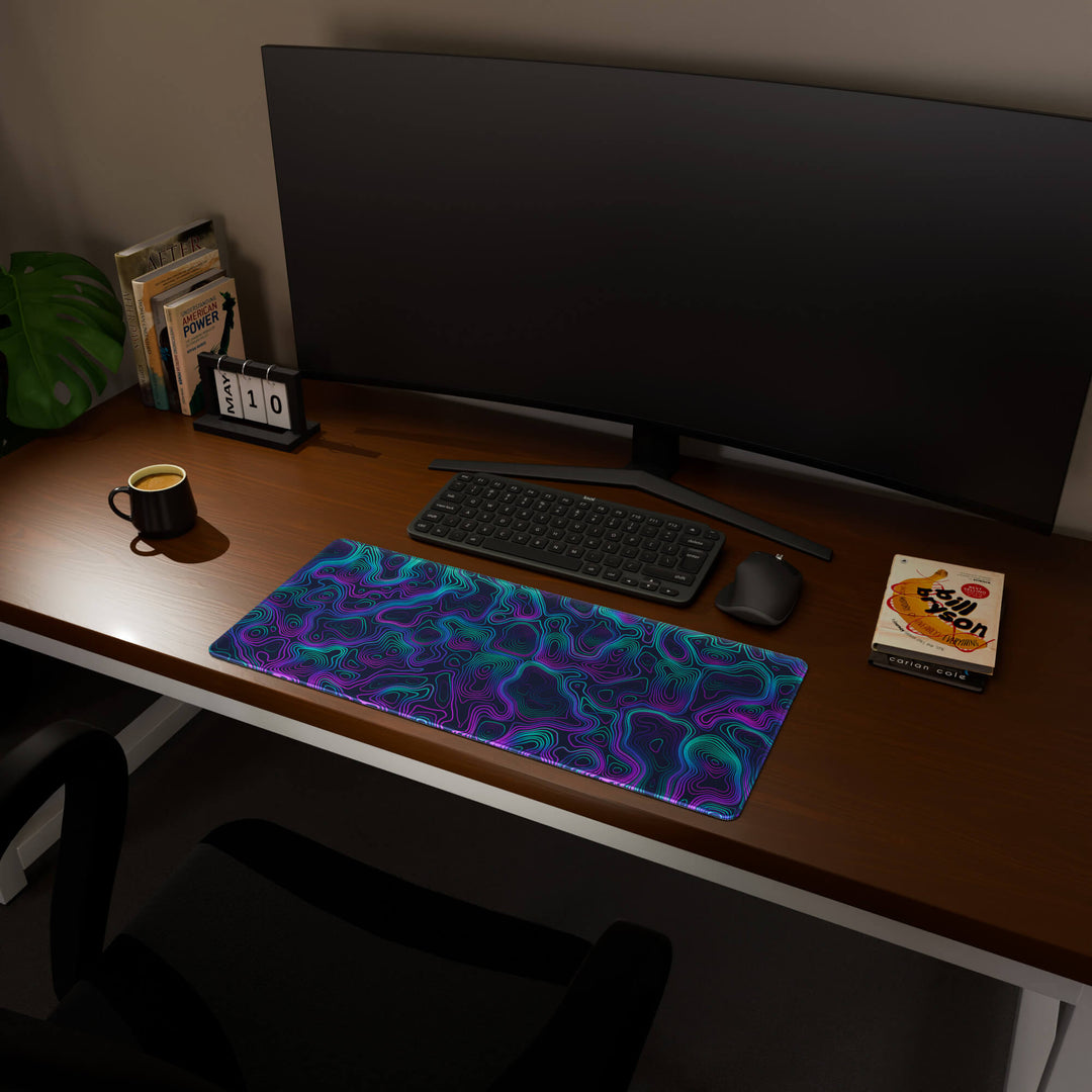 Full desktop view featuring a versatile 70x30CM-27.5x11.8in large mouse pad / desk mat with 'Neon Topographic' design, inspired by vibrant neon topographic art. Its balanced dimensions offer sufficient room for efficient navigation, making it a perfect and stylish upgrade for any standard desk.