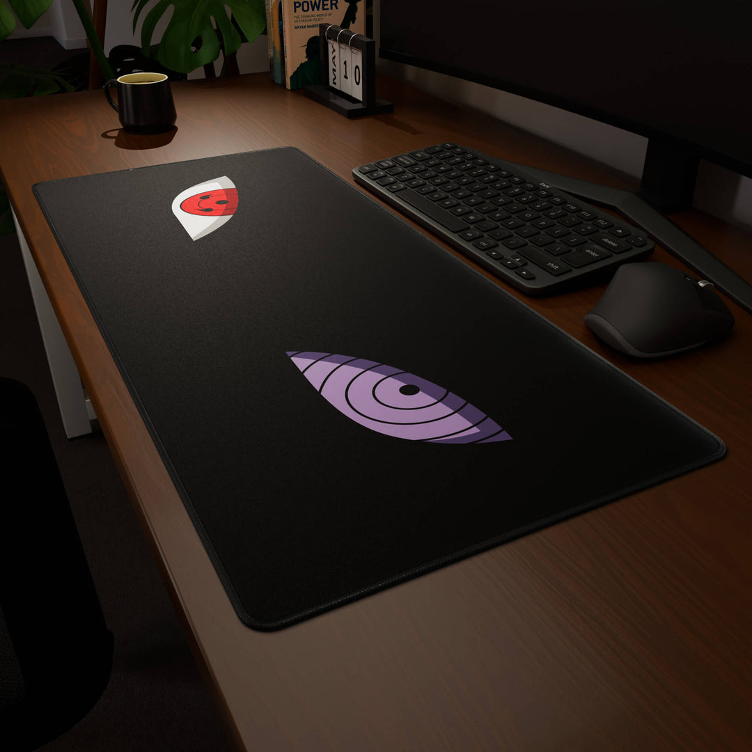 Clean angled presentation of a 90x40CM / 35x15.7in large mouse pad / desk mat showcasing the dramatic 'Dōjutsu' design, inspired by minimalist anime ninja eyes. Its high-quality fabric surface is designed for optical and laser mice, delivering superior tracking performance and responsiveness.