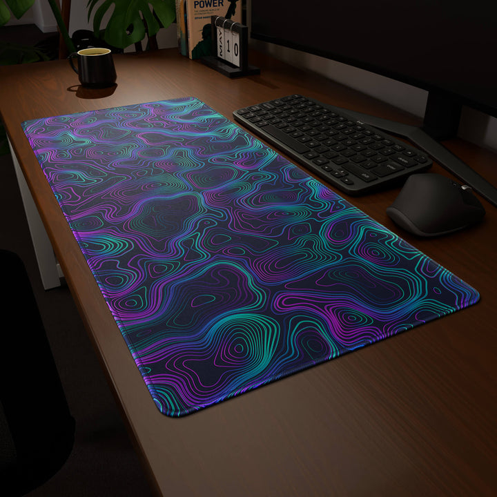 Clean angled presentation of a 90x40CM / 35x15.7in large mouse pad / desk mat showcasing the dramatic 'Neon Topographic' design, inspired by vibrant neon topographic art. Its high-quality fabric surface is designed for optical and laser mice, delivering superior tracking performance and responsiveness.