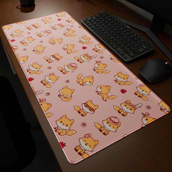 Dynamic angled perspective of a 90x40CM / 35x15.7in large mouse pad / desk mat featuring the vivid 'Kawaii Fox' design, inspired by cute kawaii pink animal art. Its generous dimensions offer a vast, smooth area that protects your desk while enhancing mouse glide and overall comfort.