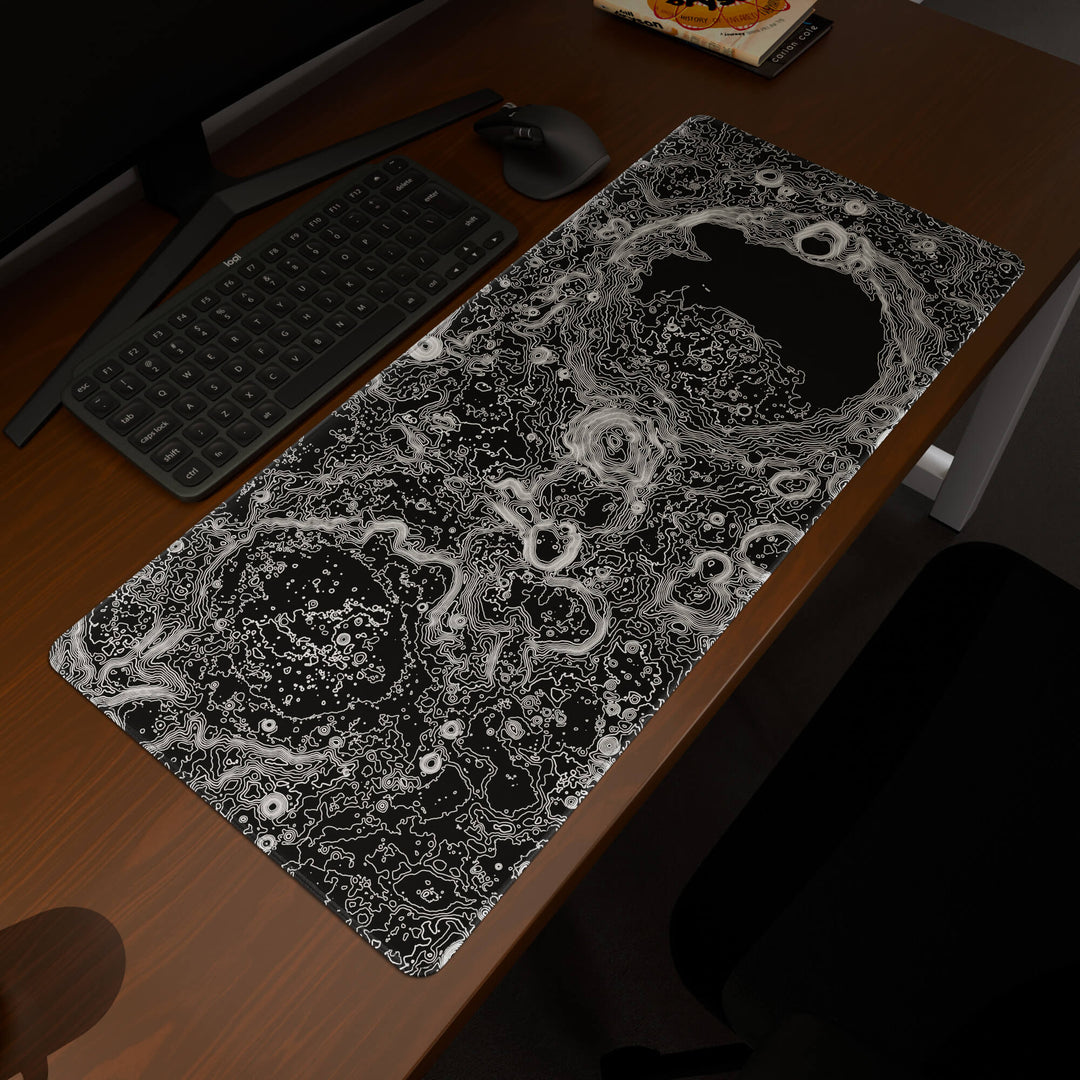 Elevated view of a 90x40CM / 35x15.7in large mouse pad / desk mat prominently displaying the 'Lunar Topographic' design, inspired by minimalist lunar surface art. This premium mat provides a stable, non-slip surface, crucial for maintaining focus and accuracy during intense gaming or work sessions.