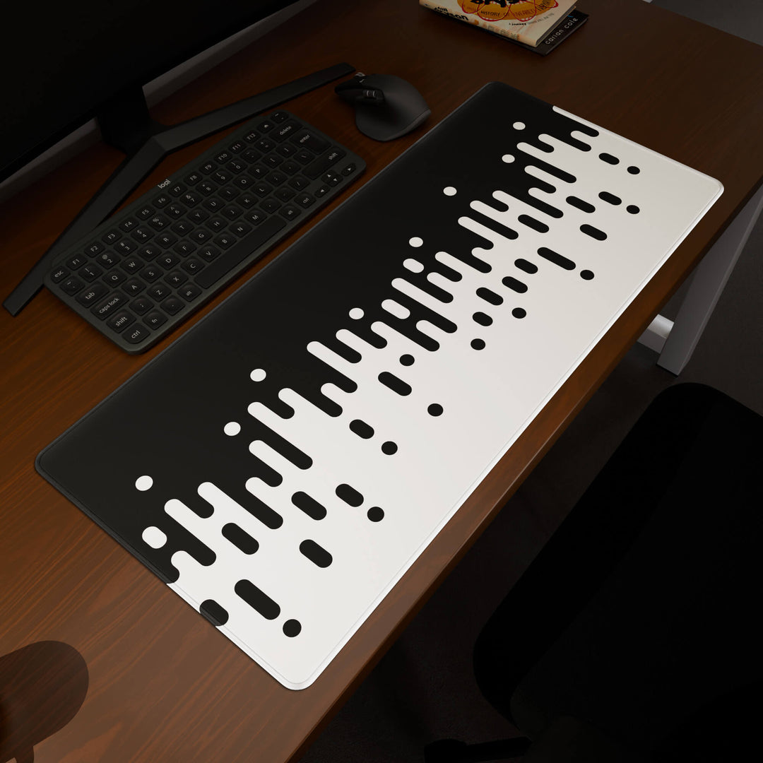 Elevated view of a 90x40CM / 35x15.7in large mouse pad / desk mat prominently displaying the 'Monochrome Drip' design, inspired by black and white minimalist art. This premium mat provides a stable, non-slip surface, crucial for maintaining focus and accuracy during intense gaming or work sessions.