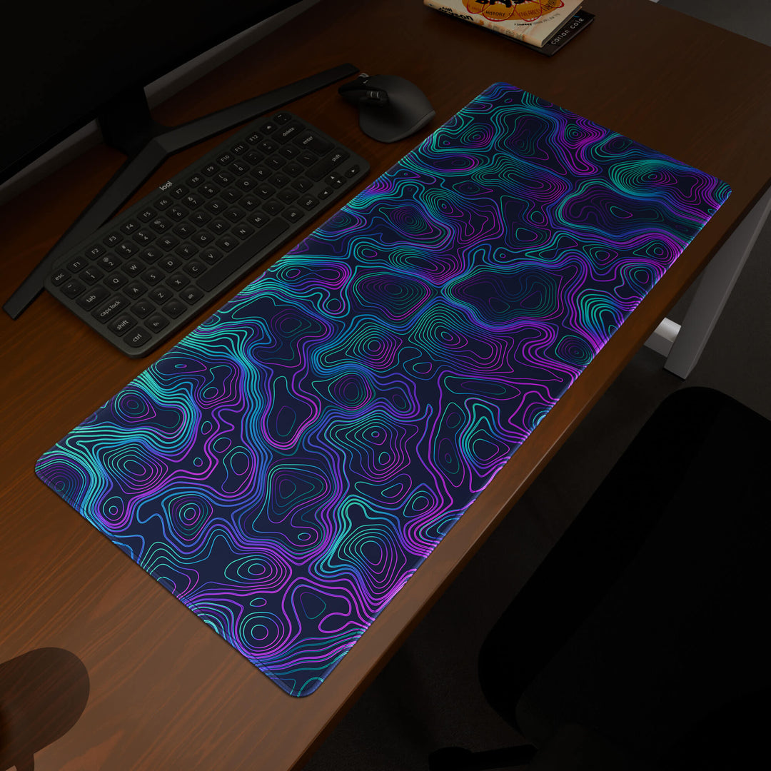 Elevated view of a 90x40CM / 35x15.7in large mouse pad / desk mat prominently displaying the 'Neon Topographic' design, inspired by vibrant neon topographic art. This premium mat provides a stable, non-slip surface, crucial for maintaining focus and accuracy during intense gaming or work sessions.
