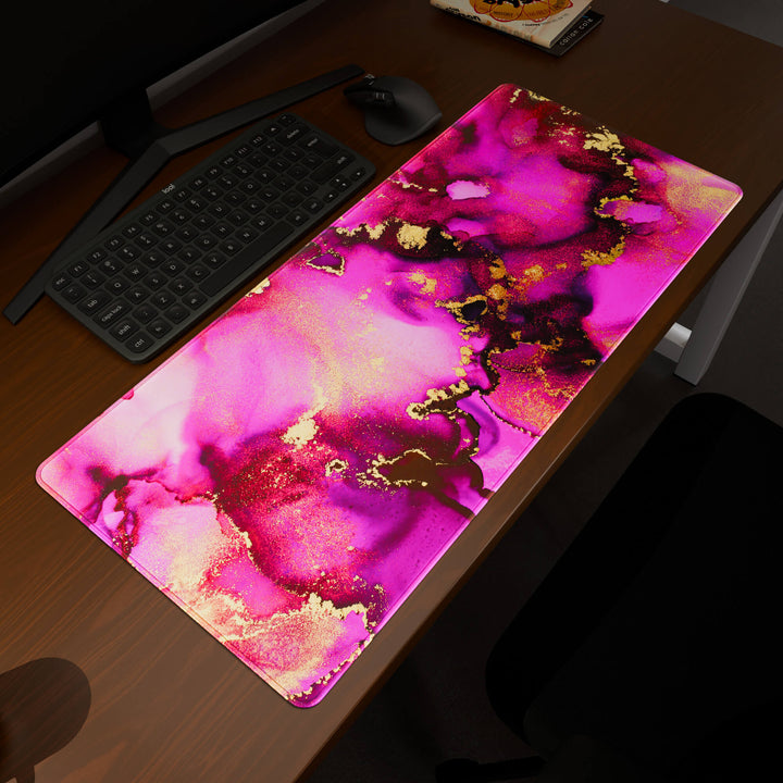 Elevated view of a 90x40CM / 35x15.7in large mouse pad / desk mat prominently displaying the 'Pink & Gold' design, inspired by pink and gold alcohol ink art. This premium mat provides a stable, non-slip surface, crucial for maintaining focus and accuracy during intense gaming or work sessions.