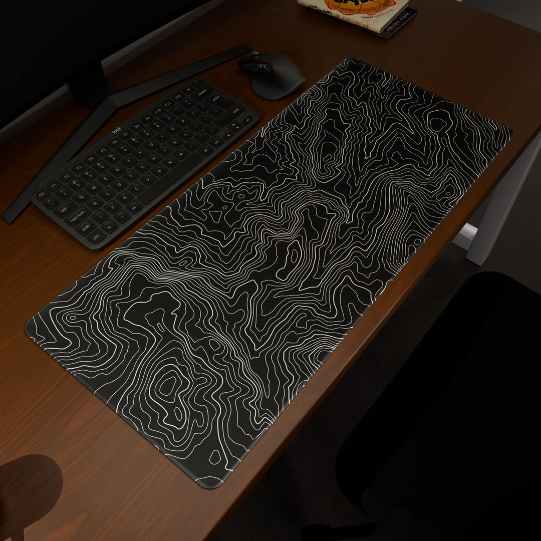 Elevated view of a 90x40CM / 35x15.7in large mouse pad / desk mat prominently displaying the 'Classic Topographic' design, inspired by minimalist topographic line art. This premium mat provides a stable, non-slip surface, crucial for maintaining focus and accuracy during intense gaming or work sessions.