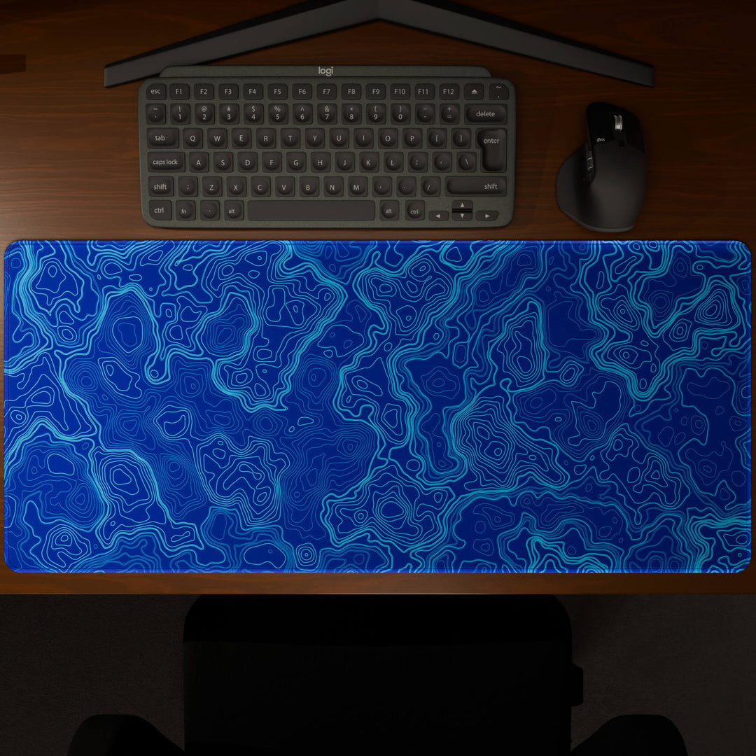 Top-down view of a 90x40CM / 35x15.7in large mouse pad / desk mat showcasing the full 'Blue Topographic' design, inspired by blue minimalist topographic art. The large surface provides ample space for keyboard and mouse, ensuring precise control and comfortable use for both gaming and office tasks.