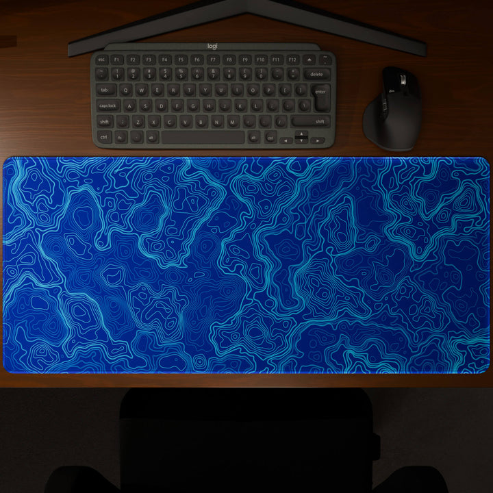 Top-down view of a 90x40CM / 35x15.7in large mouse pad / desk mat showcasing the full 'Blue Topographic' design, inspired by blue minimalist topographic art. The large surface provides ample space for keyboard and mouse, ensuring precise control and comfortable use for both gaming and office tasks.