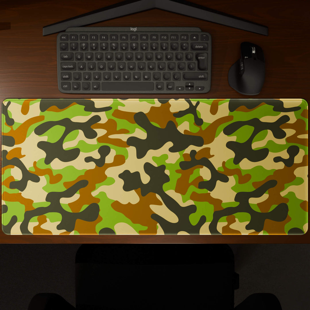 Top-down view of a 90x40CM / 35x15.7in large mouse pad / desk mat showcasing the full 'Woodland Camo' design, inspired by a classic woodland camouflage pattern. The large surface provides ample space for keyboard and mouse, ensuring precise control and comfortable use for both gaming and office tasks.