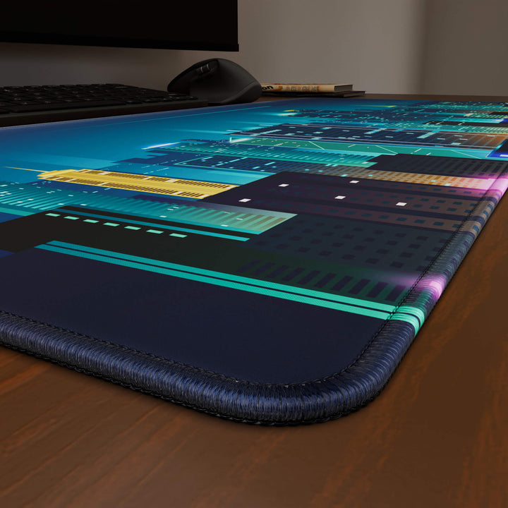 Close-up angled shot highlighting the durable stitched edges of a 90x40CM / 35x15.7in large mouse pad / desk mat with the 'Neon City' design, inspired by cyberpunk cityscape art. The reinforced stitching prevents fraying, ensuring long-lasting durability and a consistently clean aesthetic.