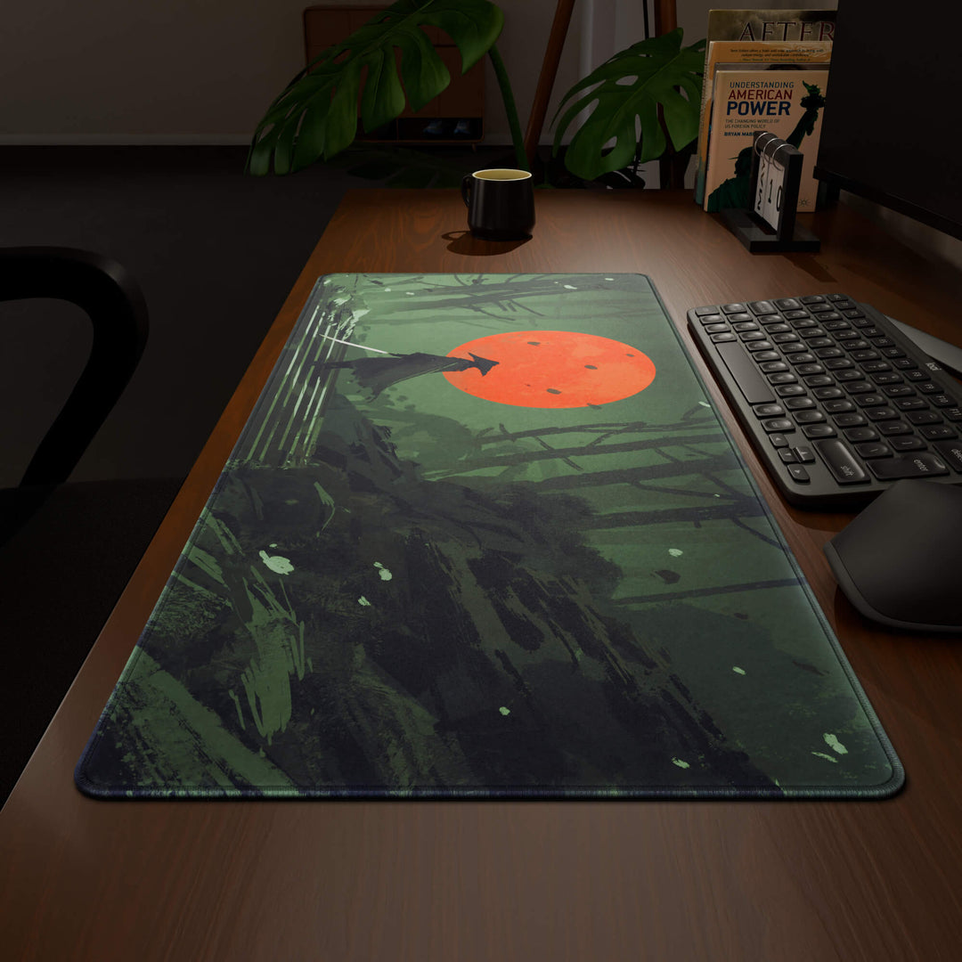 Wide angled view of a complete desk setup, featuring a 90x40CM / 35x15.7in large mouse pad / desk mat with the captivating 'Blood Moon Samurai' design, inspired by dark fantasy samurai art. This extra-large mousepad seamlessly integrates into any workspace, providing a cohesive and productive environment.