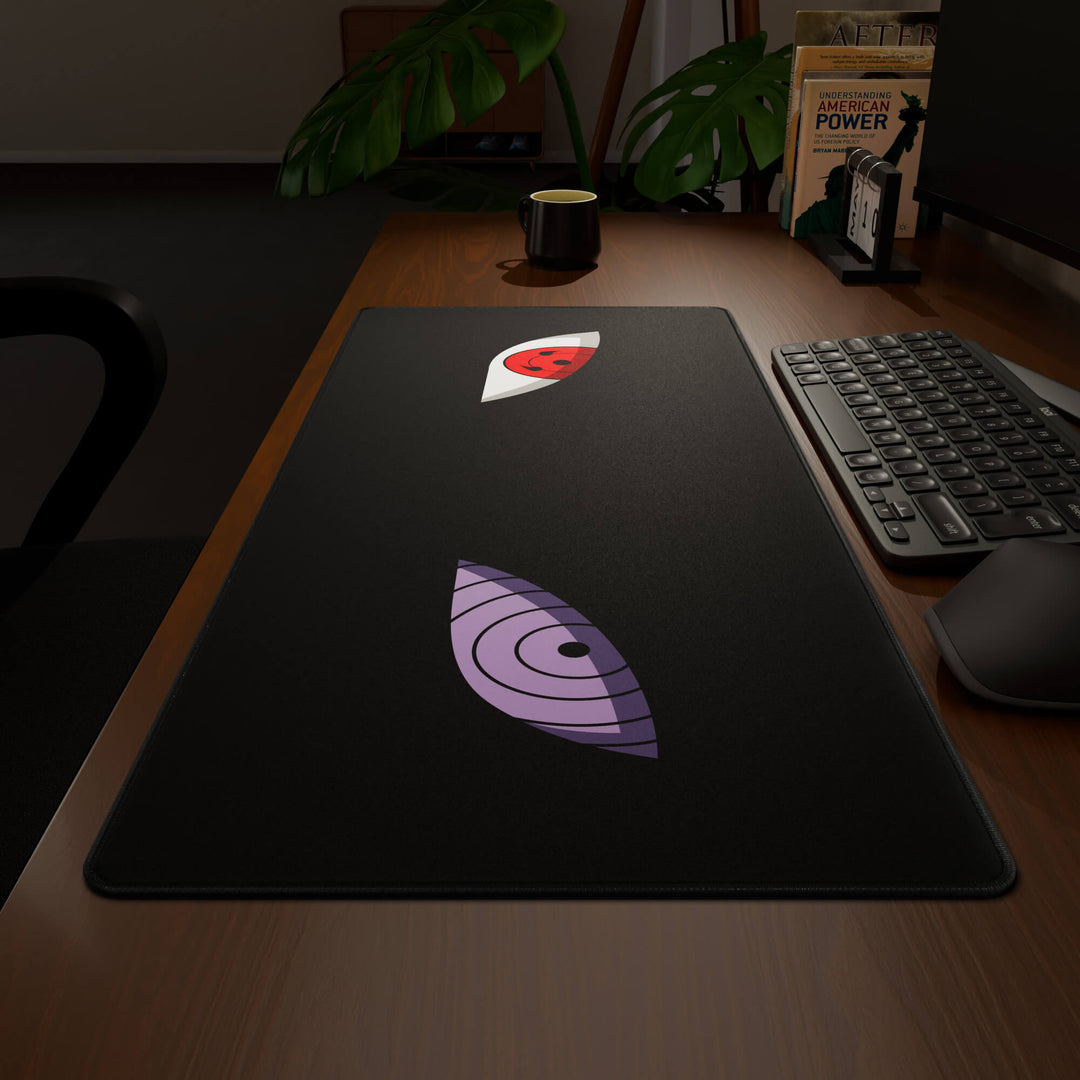 Wide angled view of a complete desk setup, featuring a 90x40CM / 35x15.7in large mouse pad / desk mat with the captivating 'Dōjutsu' design, inspired by minimalist anime ninja eyes. This extra-large mousepad seamlessly integrates into any workspace, providing a cohesive and productive environment.