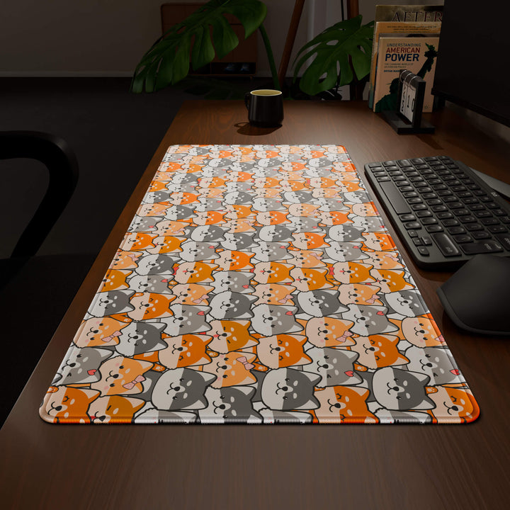 Wide angled view of a complete desk setup, featuring a 90x40CM / 35x15.7in large mouse pad / desk mat with the captivating 'Miniature Pups' design, inspired by a cute kawaii dog pattern. This extra-large mousepad seamlessly integrates into any workspace, providing a cohesive and productive environment.
