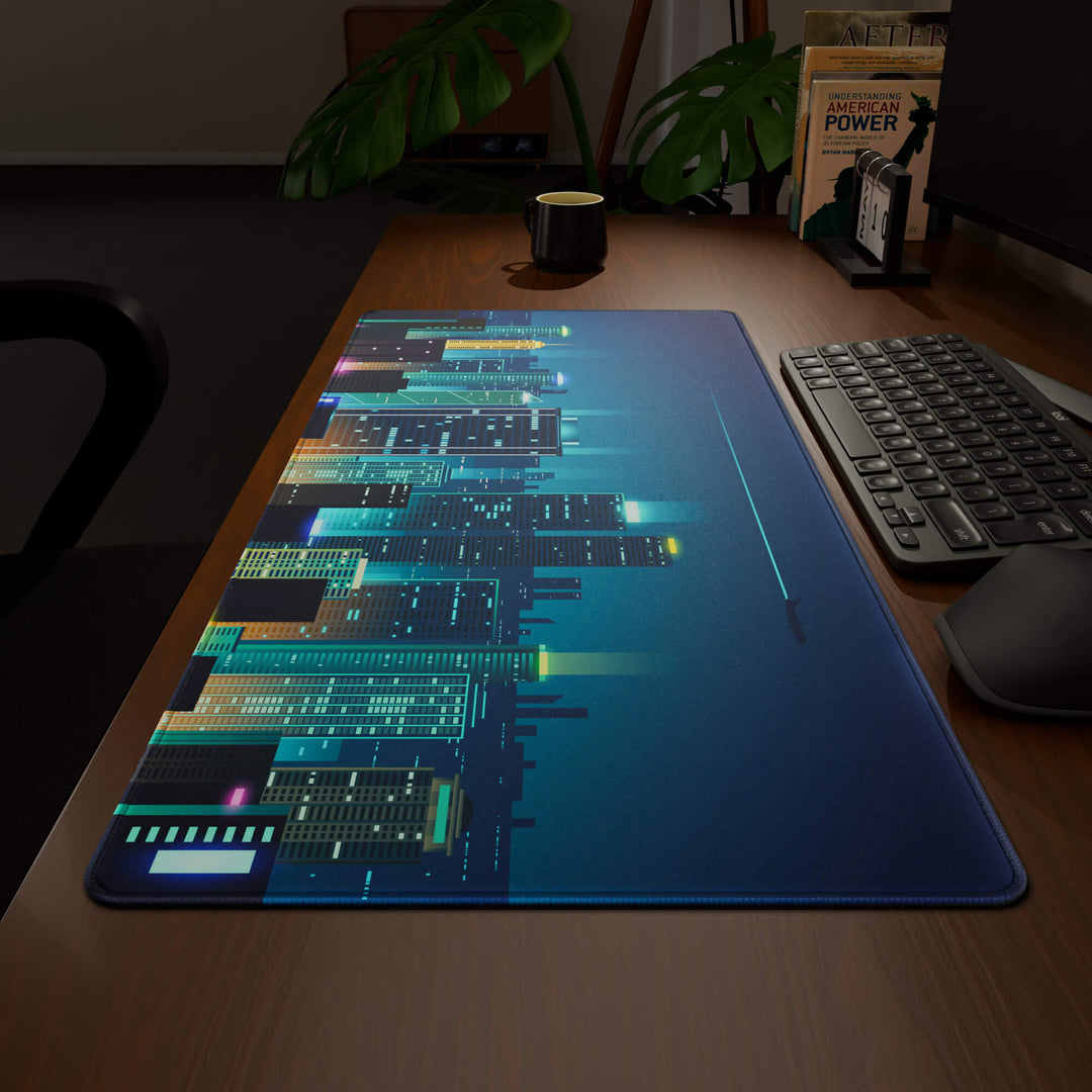 Wide angled view of a complete desk setup, featuring a 90x40CM / 35x15.7in large mouse pad / desk mat with the captivating 'Neon City' design, inspired by cyberpunk cityscape art. This extra-large mousepad seamlessly integrates into any workspace, providing a cohesive and productive environment.