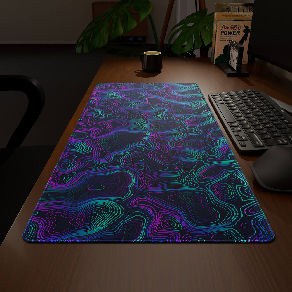 Wide angled view of a complete desk setup, featuring a 90x40CM / 35x15.7in large mouse pad / desk mat with the captivating 'Neon Topographic' design, inspired by vibrant neon topographic art. This extra-large mousepad seamlessly integrates into any workspace, providing a cohesive and productive environment.