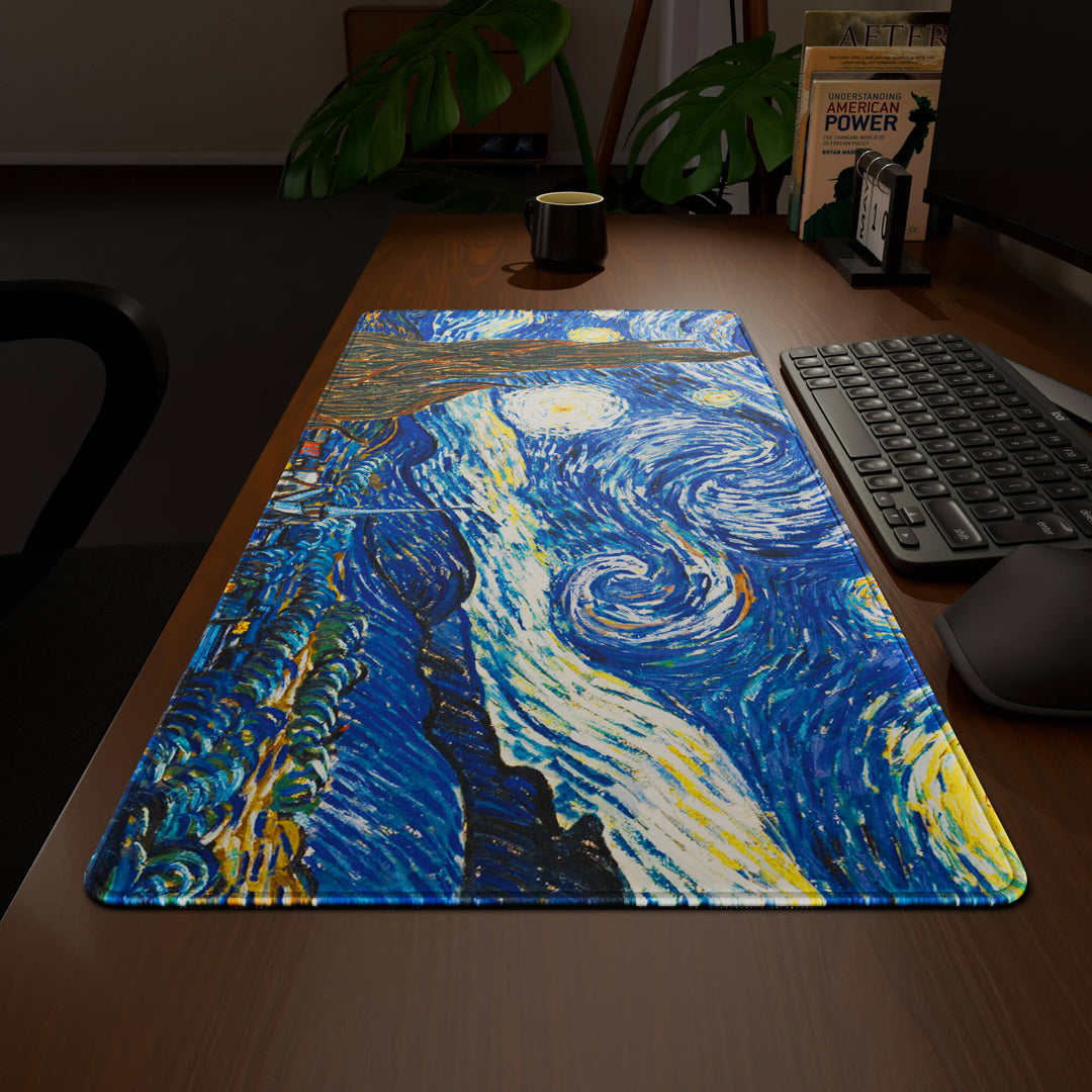 Wide angled view of a complete desk setup, featuring a 90x40CM / 35x15.7in large mouse pad / desk mat with the captivating 'The Starry Night' design, inspired by Van Gogh classic art. This extra-large mousepad seamlessly integrates into any workspace, providing a cohesive and productive environment.
