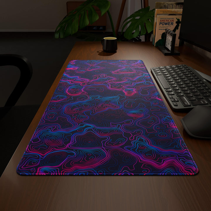 Wide angled view of a complete desk setup, featuring a 90x40CM / 35x15.7in large mouse pad / desk mat with the captivating 'Vaporwave Topographic' design, inspired by vibrant vaporwave and neon topographic art. This extra-large mousepad seamlessly integrates into any workspace, providing a cohesive and productive environment.