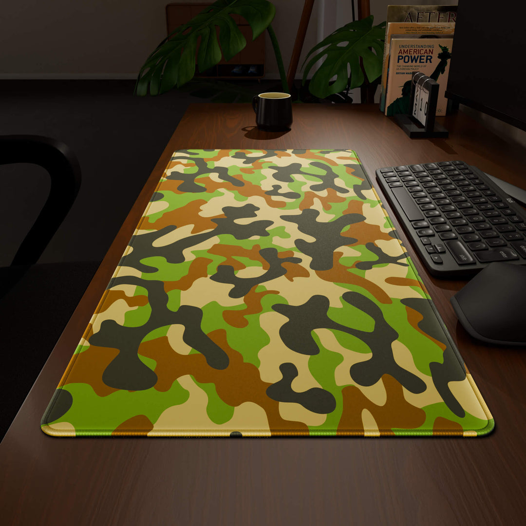 Wide angled view of a complete desk setup, featuring a 90x40CM / 35x15.7in large mouse pad / desk mat with the captivating 'Woodland Camo' design, inspired by a classic woodland camouflage pattern. This extra-large mousepad seamlessly integrates into any workspace, providing a cohesive and productive environment.
